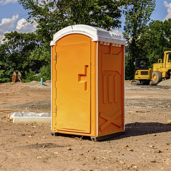 what is the cost difference between standard and deluxe portable restroom rentals in Igo